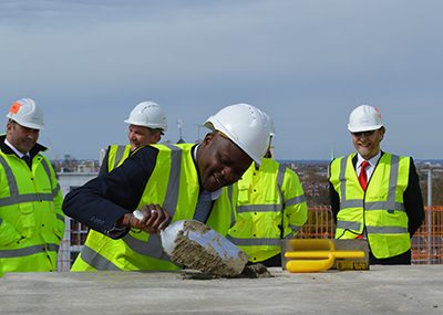 Staff at a topping out ceremony at Grand Regent Tower, London