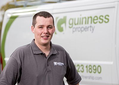 A Guinness operative in front of a repairs van