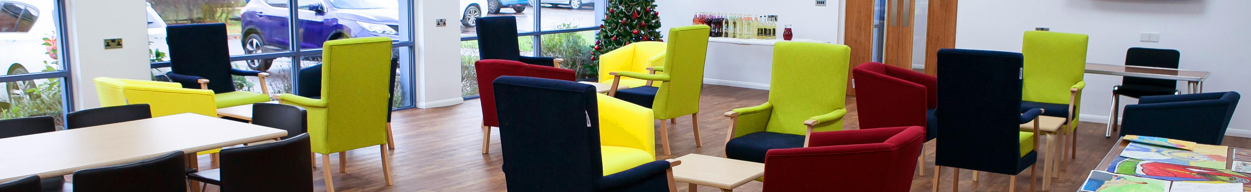 Dementia-friendly Jubilee Court with brightly colour chairs